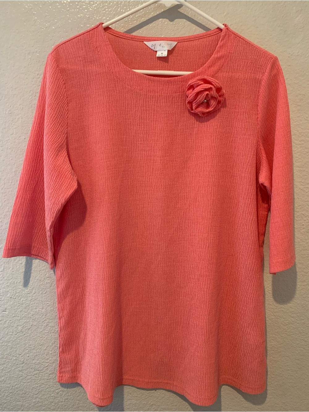 Coral Ponte Knit Floral Pin Women's Top